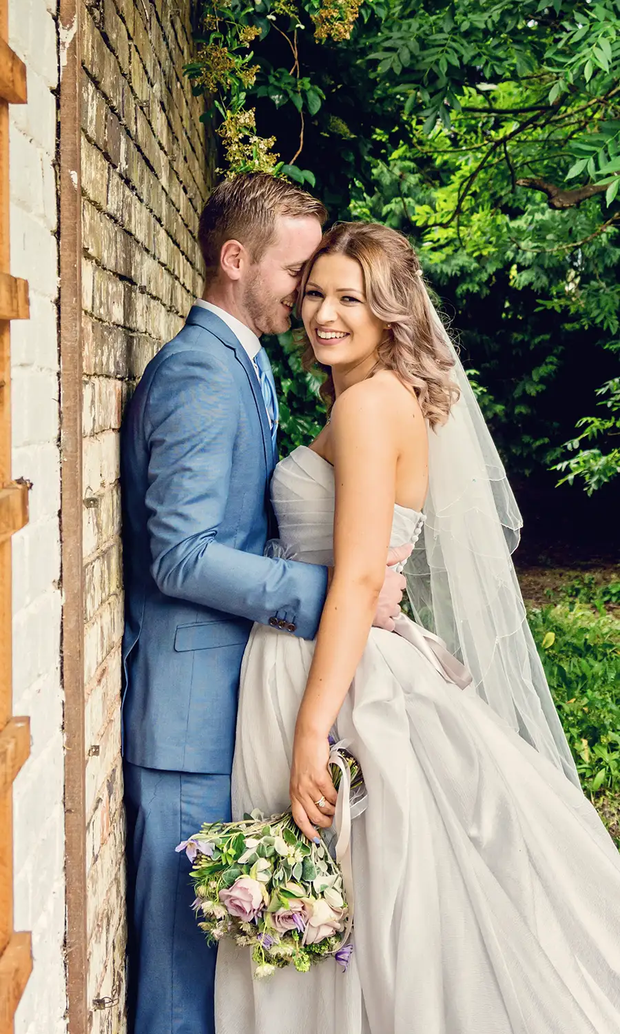 Newlyweds outside a historic church in Bromsgrove Newlyweds outside a historic church in Bromsgrove