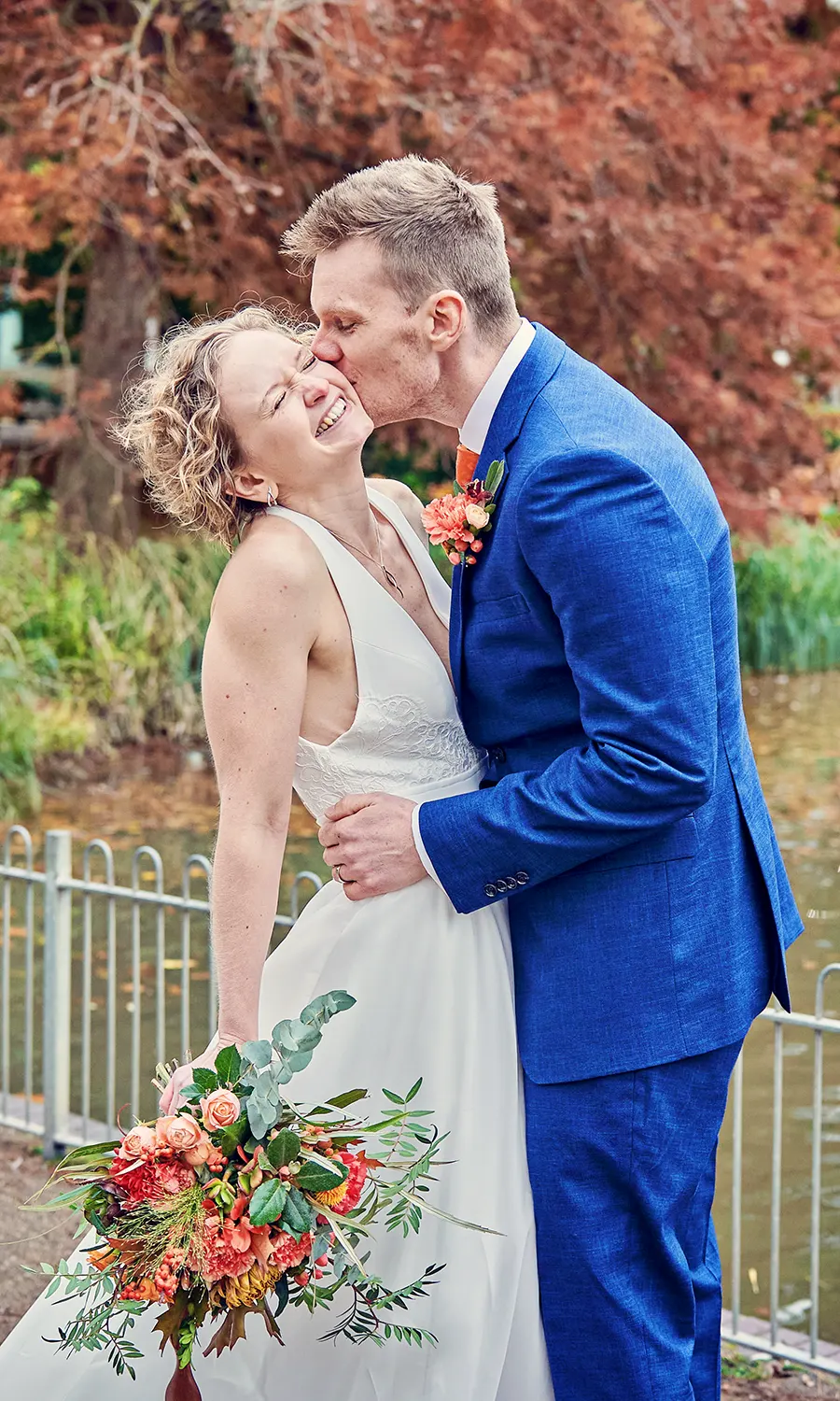 A quiet candid kiss during a Stratford wedding celebration A quiet candid kiss during a Stratford wedding celebration
